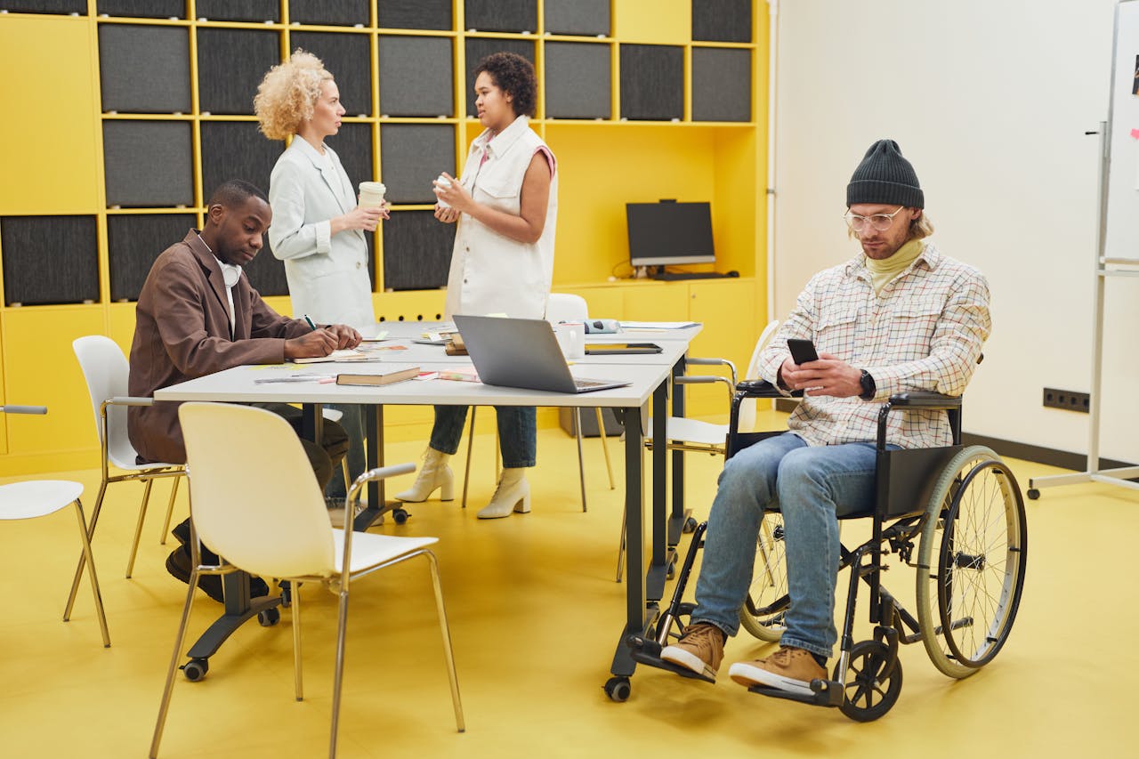 Mastering the First Impression: Your intriguing post title goes here A diverse office team collaborating indoors, showcasing teamwork and inclusivity.